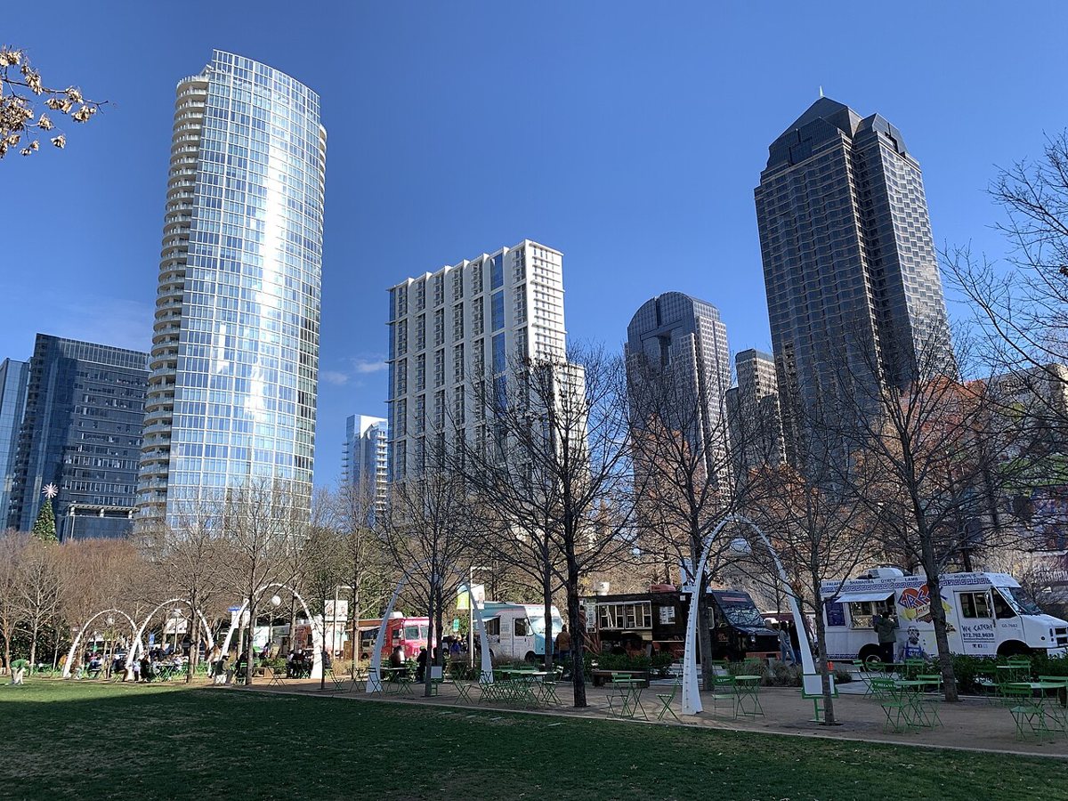 Visitors relaxing on the lawn at Klyde Warren Park in Dallas during spring