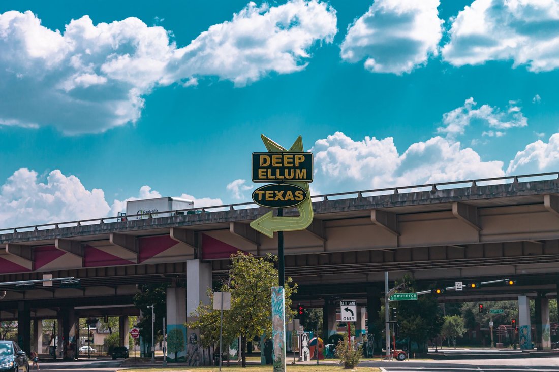 the Deep Ellum Texas gateway sign under the freeway