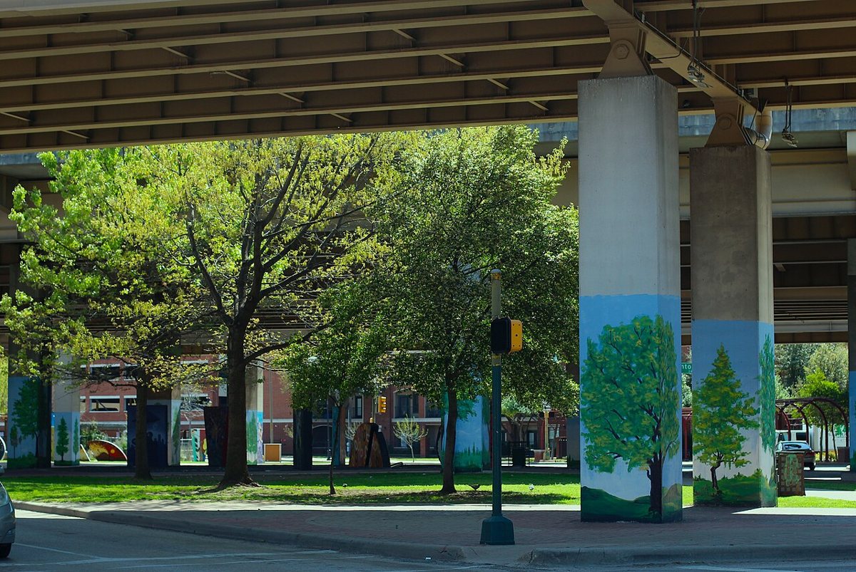hand-painted murals covering a warehouse wall in Deep Ellum